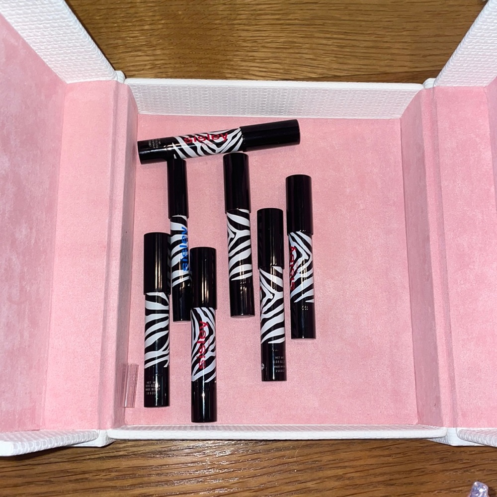 6 sisley lip sticks 1 sisley eye shadow + magnetic sisley box with pink lining